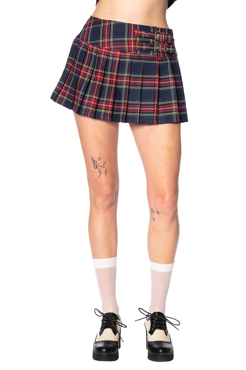Alternative model in navy and red tartan skirt with white socks