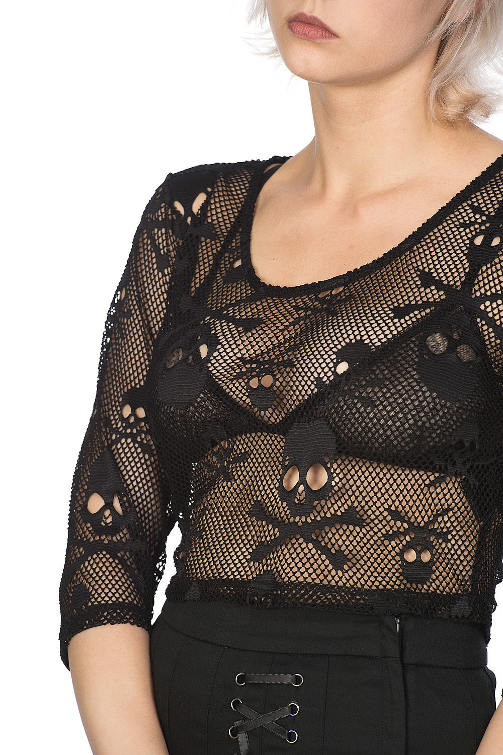 Alternative model in mesh crop top with skulls