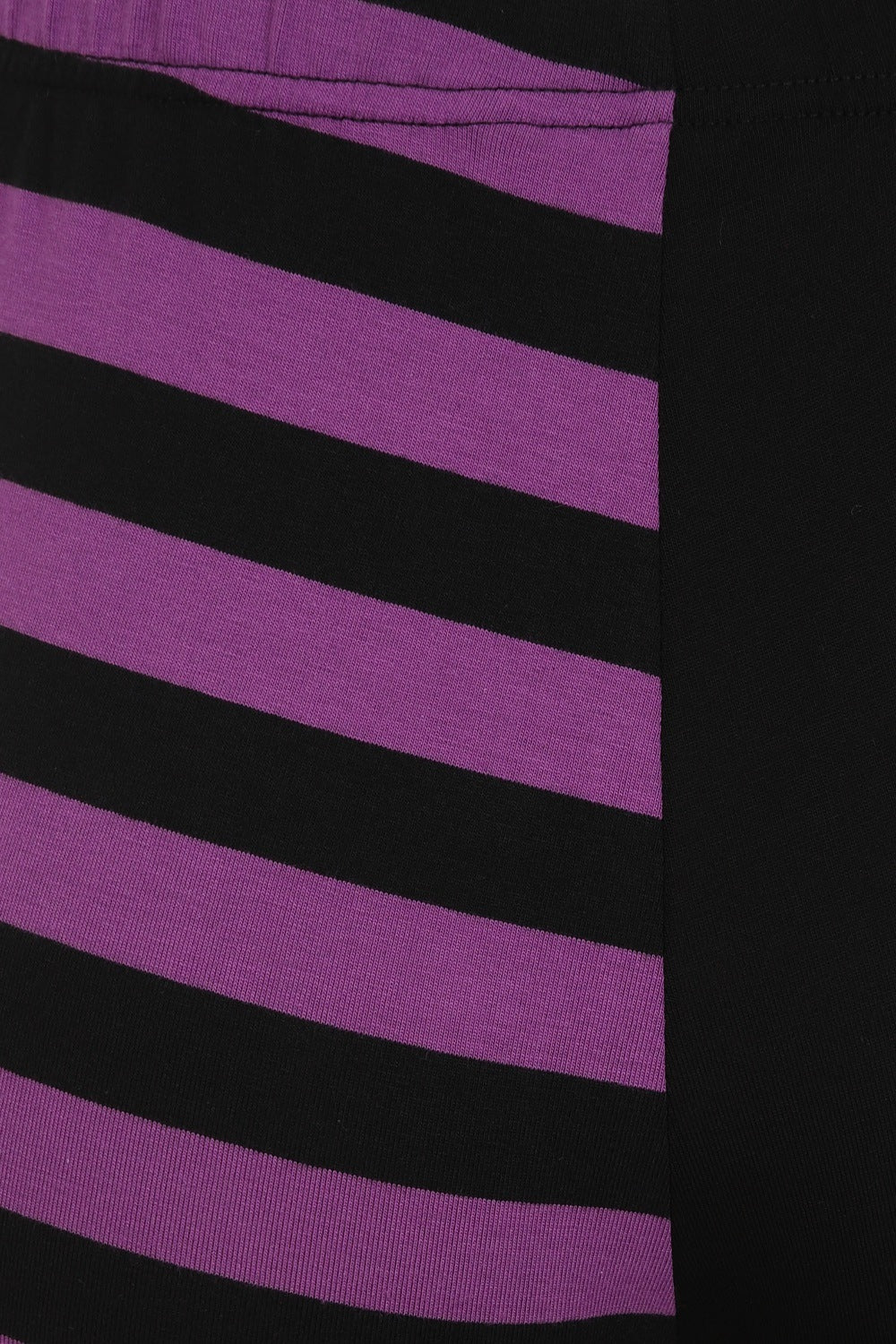 High waisted leggings with one striped purple leg and zip waist