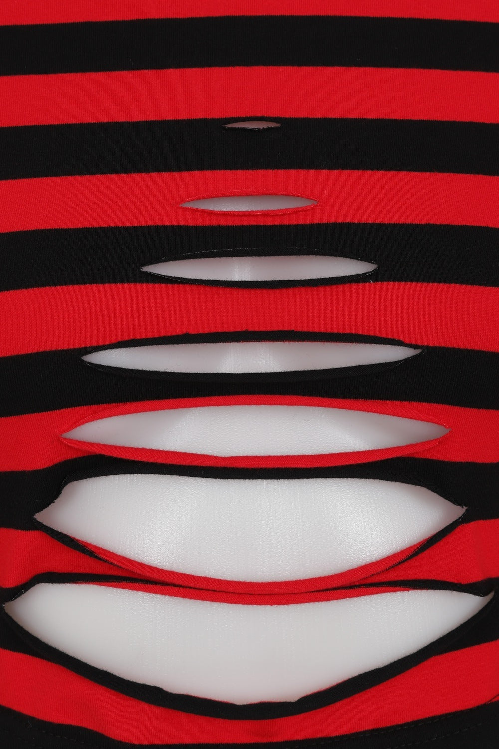 Red and black stripe crop top with rip designs, long sleeves and thumb holes