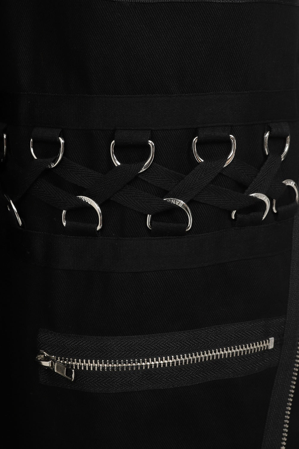 Baggy black trousers with zip and buckle features
