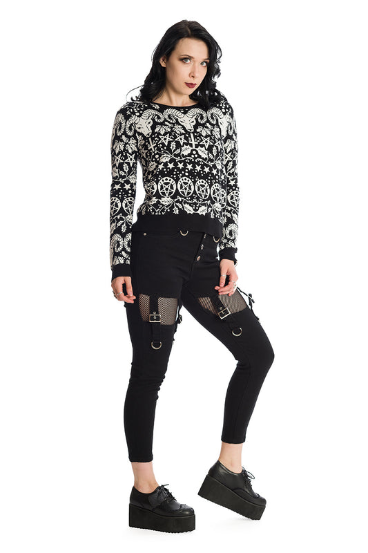 Model wearing black satanic printed jumper with Mid rise black trousers with black mesh cut outs on the thighs and strap details