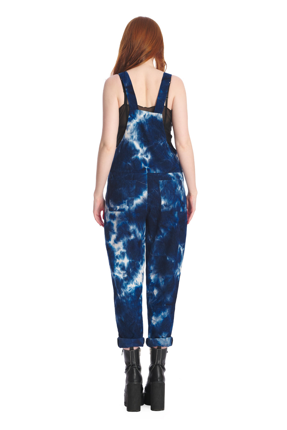 Alternative model wearing blue tie dye dungarees