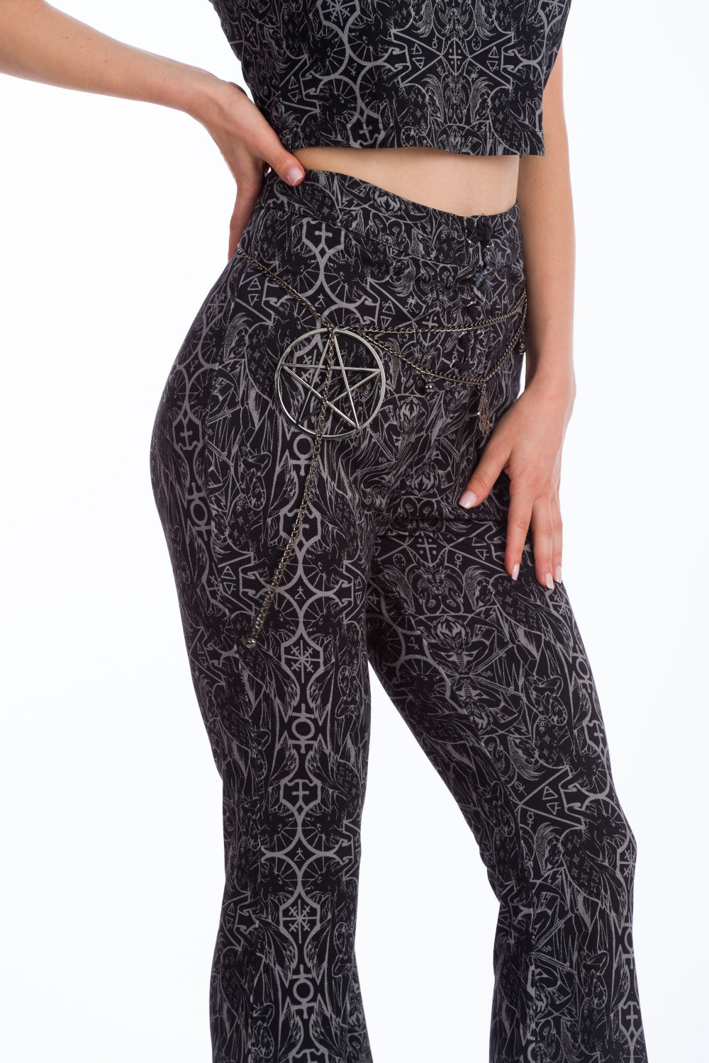 Alternative model is matching co-ord set with pentagram chain belt