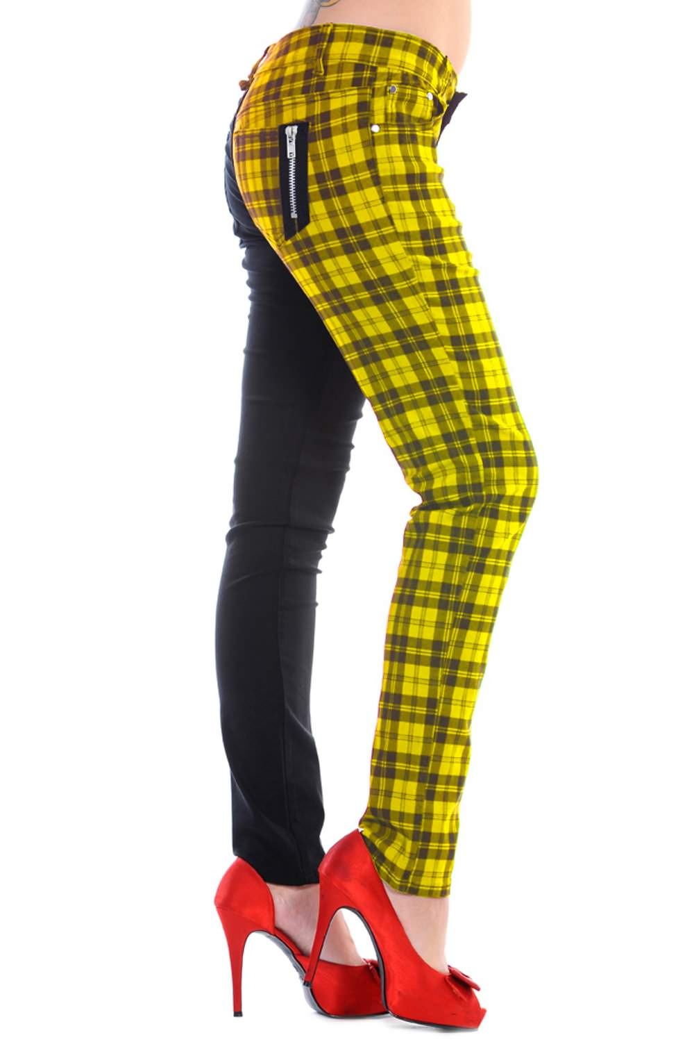 Low rise skinny jeans with one black leg and one yellow check leg