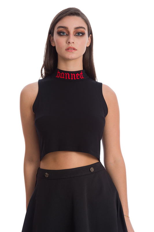 Model wearing black crop top with high neck with word 'banned' in red embroided on 