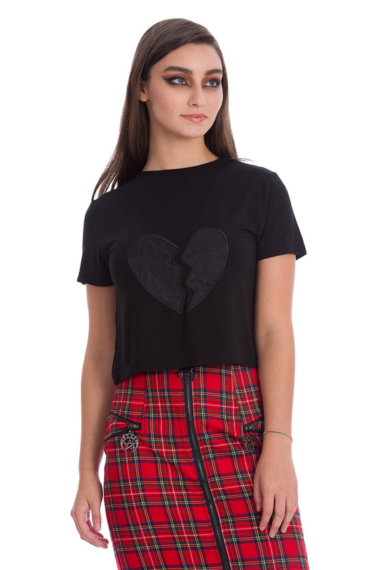 Alternative model in crop black top with heart broken motif