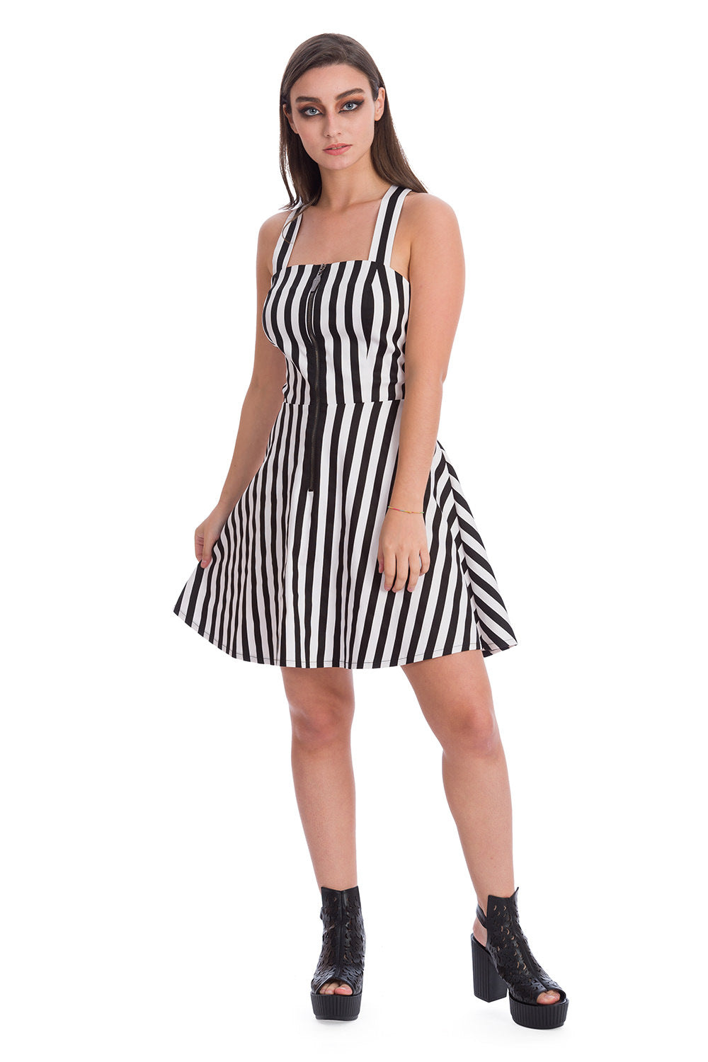 Alternative model wearing a black and white striped strap dress