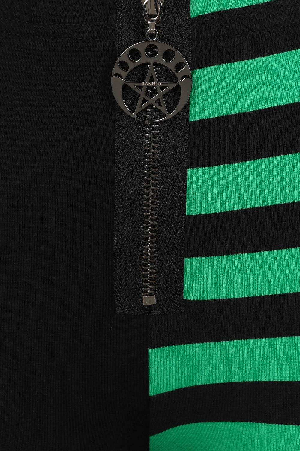 High waisted leggings with one striped green leg and zip waist and pentagram pendant
