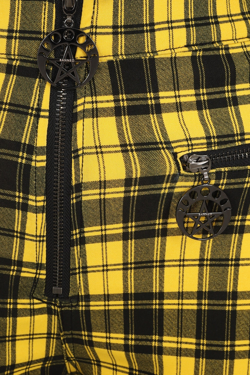 High waisted trousers in yellow tartan with zip front and pentagram zip details