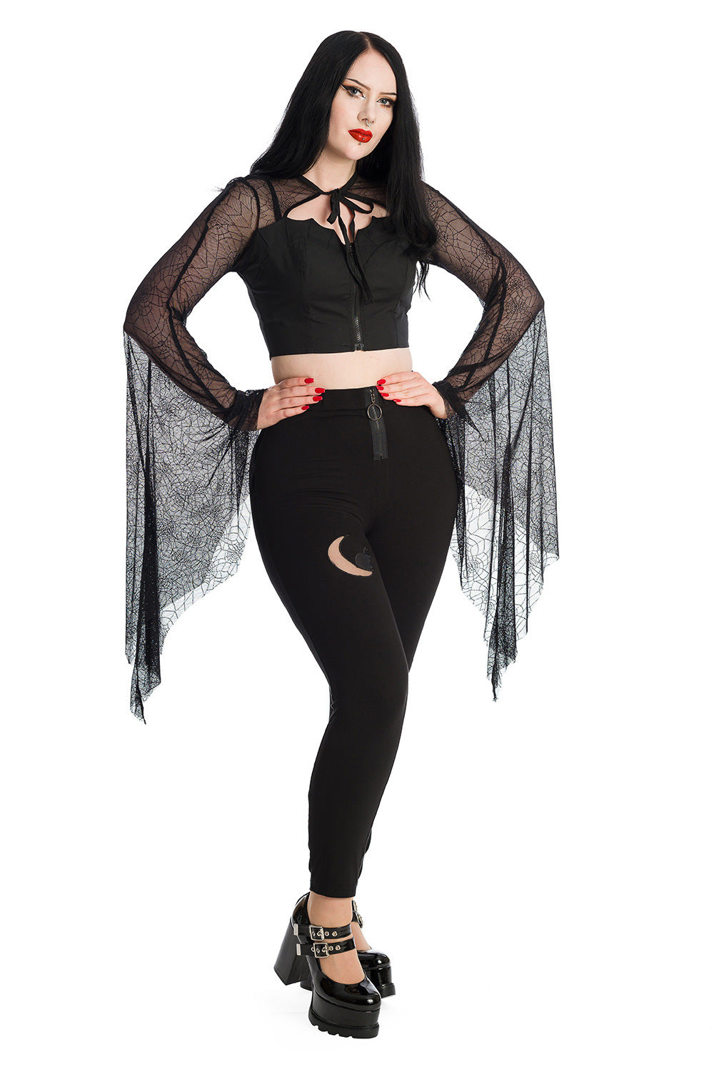Alternative model wearing a gothic bat wing lace sleeved crop top with high waisted leggings with a moon panel 