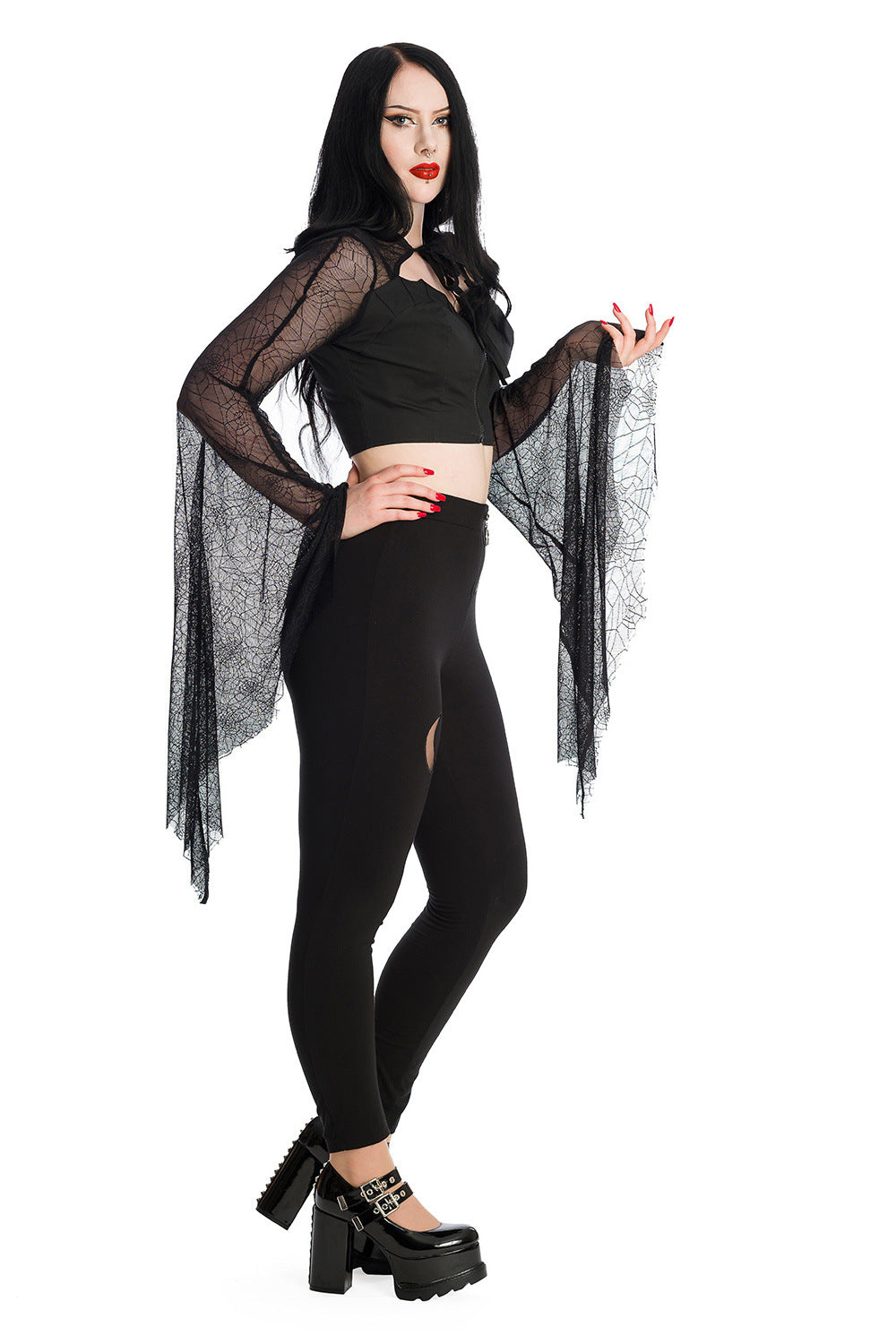 Alternative model wearing a gothic bat wing lace sleeved crop top with high waisted leggings with a moon panel