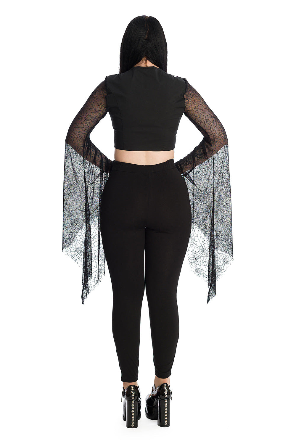 Alternative model wearing a gothic bat wing lace sleeved crop top with high waisted leggings with a moon panel