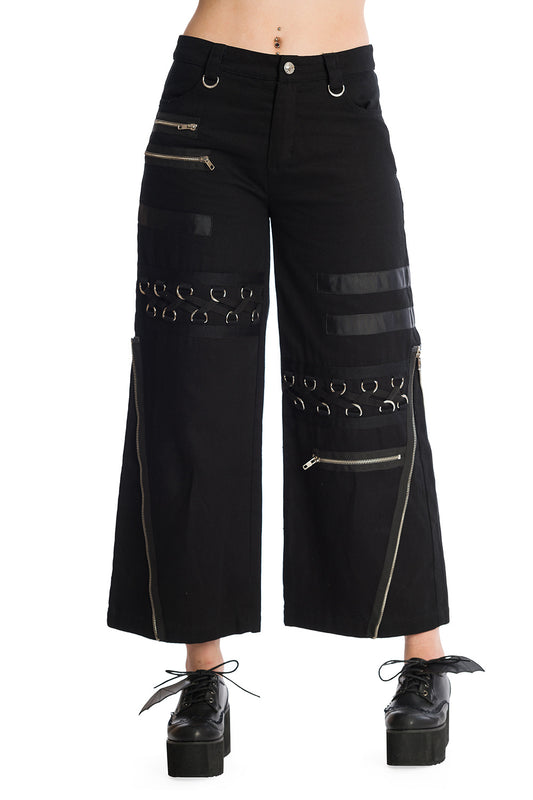 Baggy black trousers with zip and buckle features