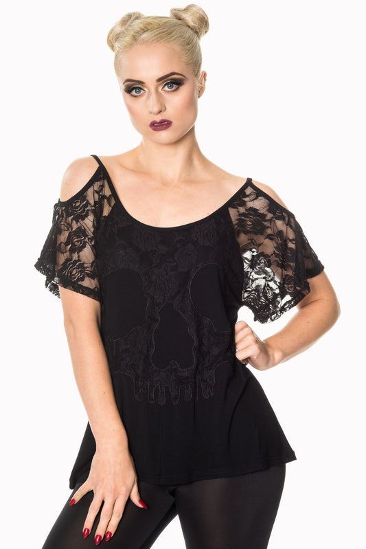 Model wearing lace top with skull detail in black
