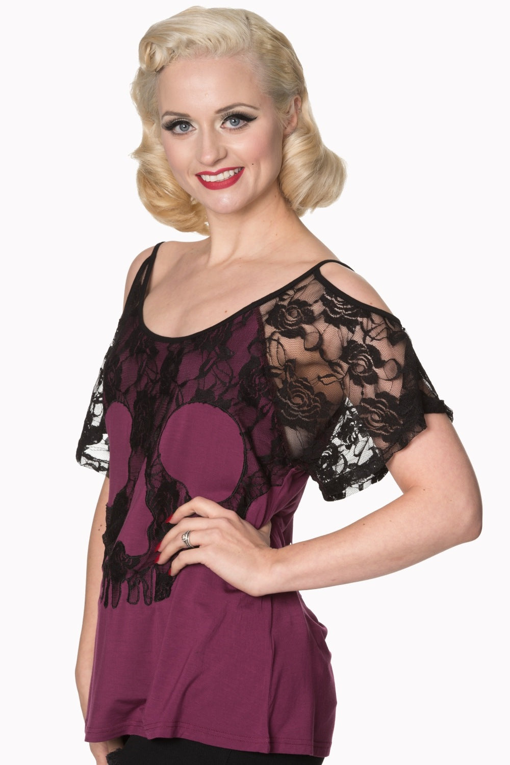 Model wearing lace top with skull detail in purple