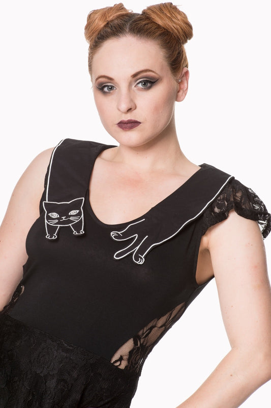 Model wearing black a line dress with lace skirt and cat detail collar