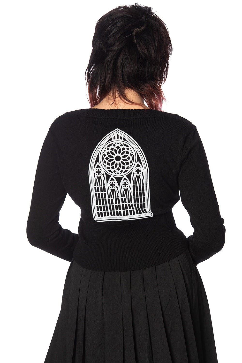 Model shows back of black cardigan showing cathedral motif 