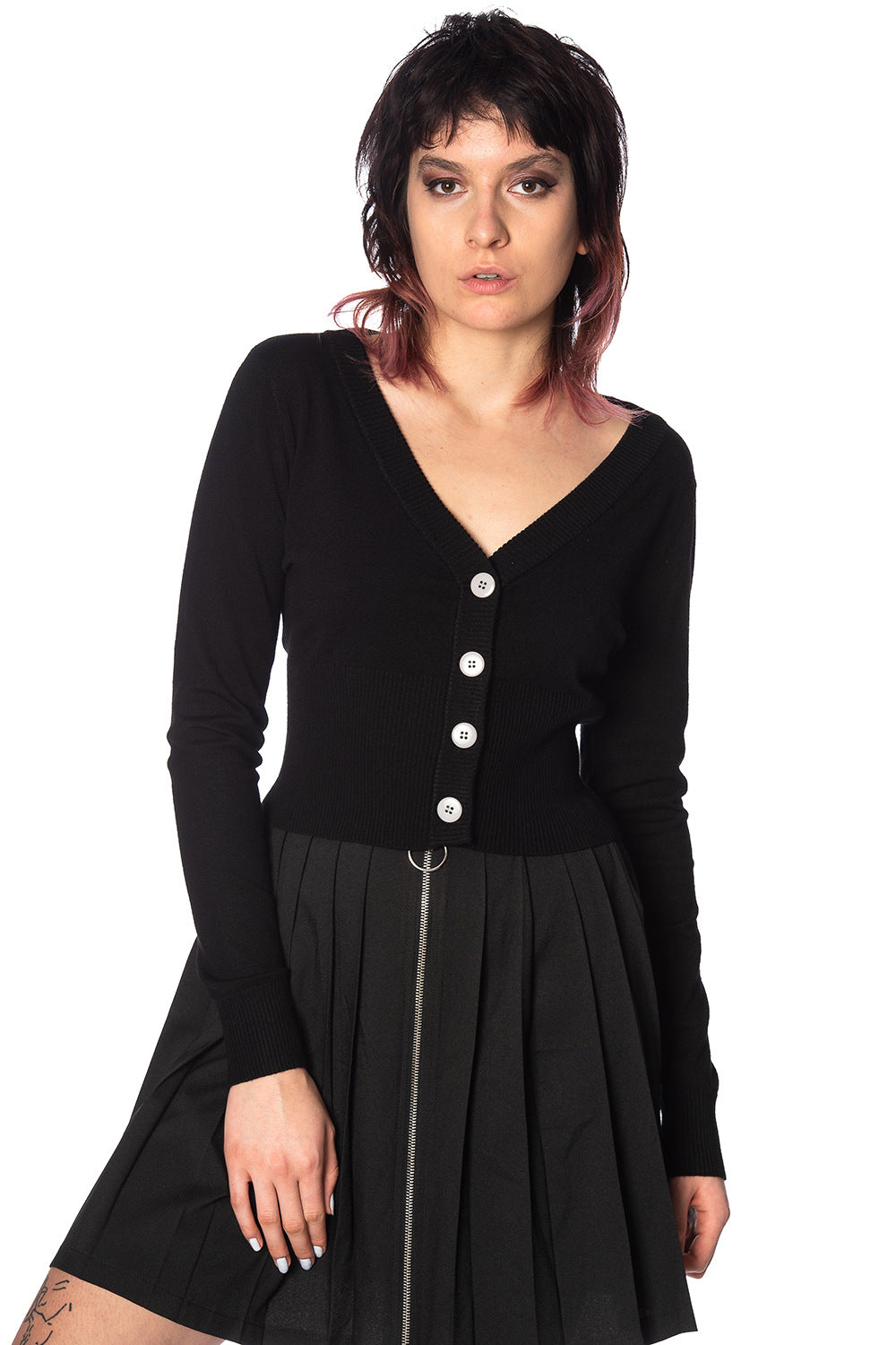 Alternative model wearing a black button up cardigan with black skirt 