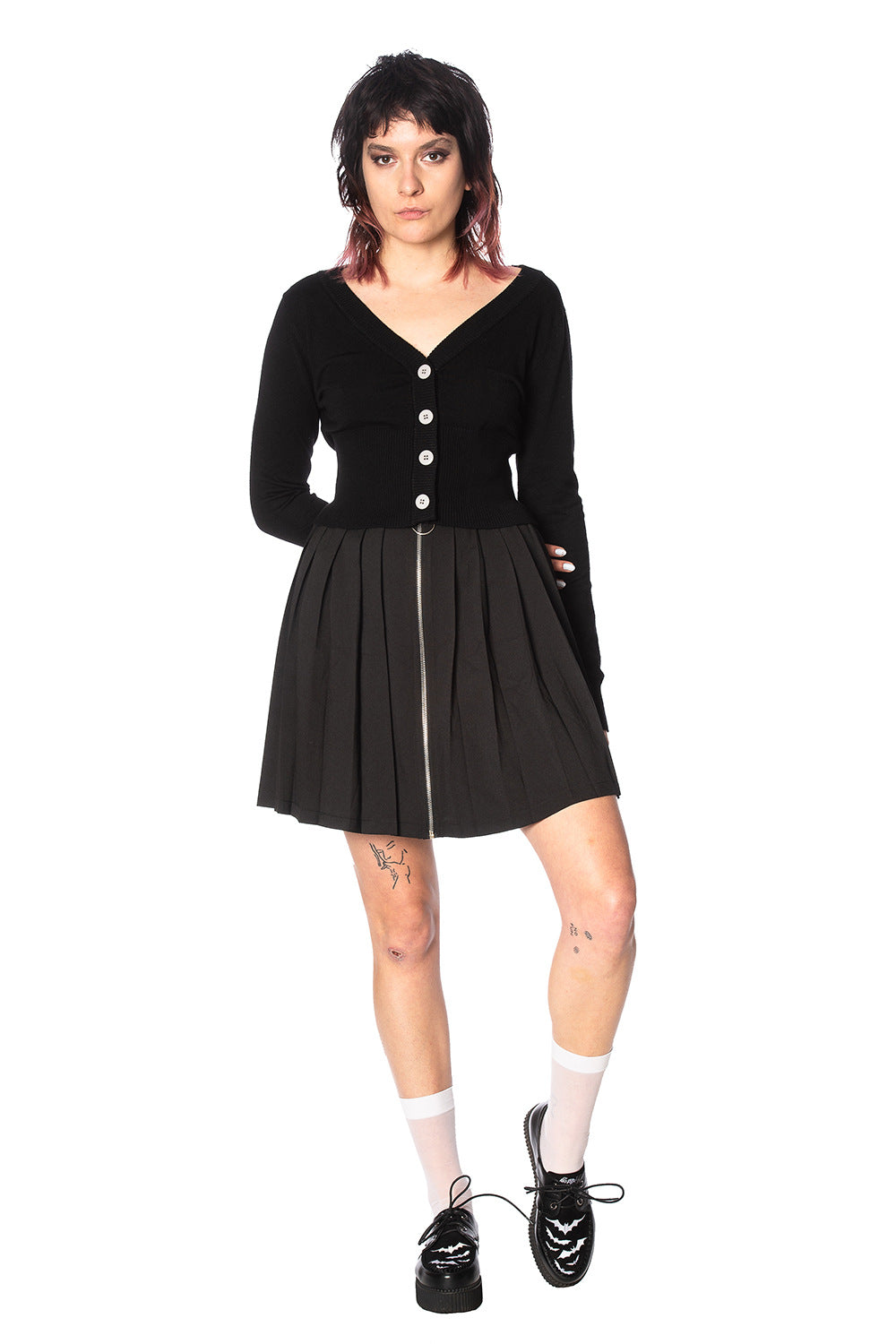 Alternative model wearing a black button up cardigan with black skirt