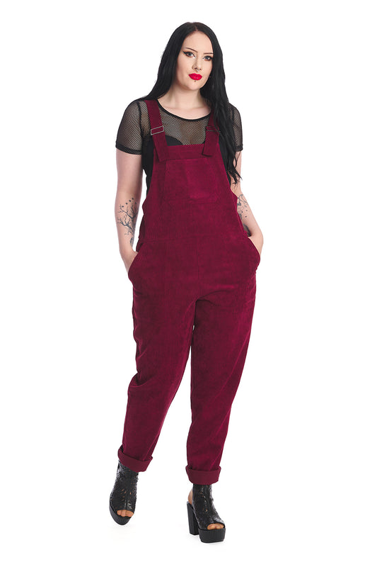 Gothic model in burgundy dungarees with a black mesh top