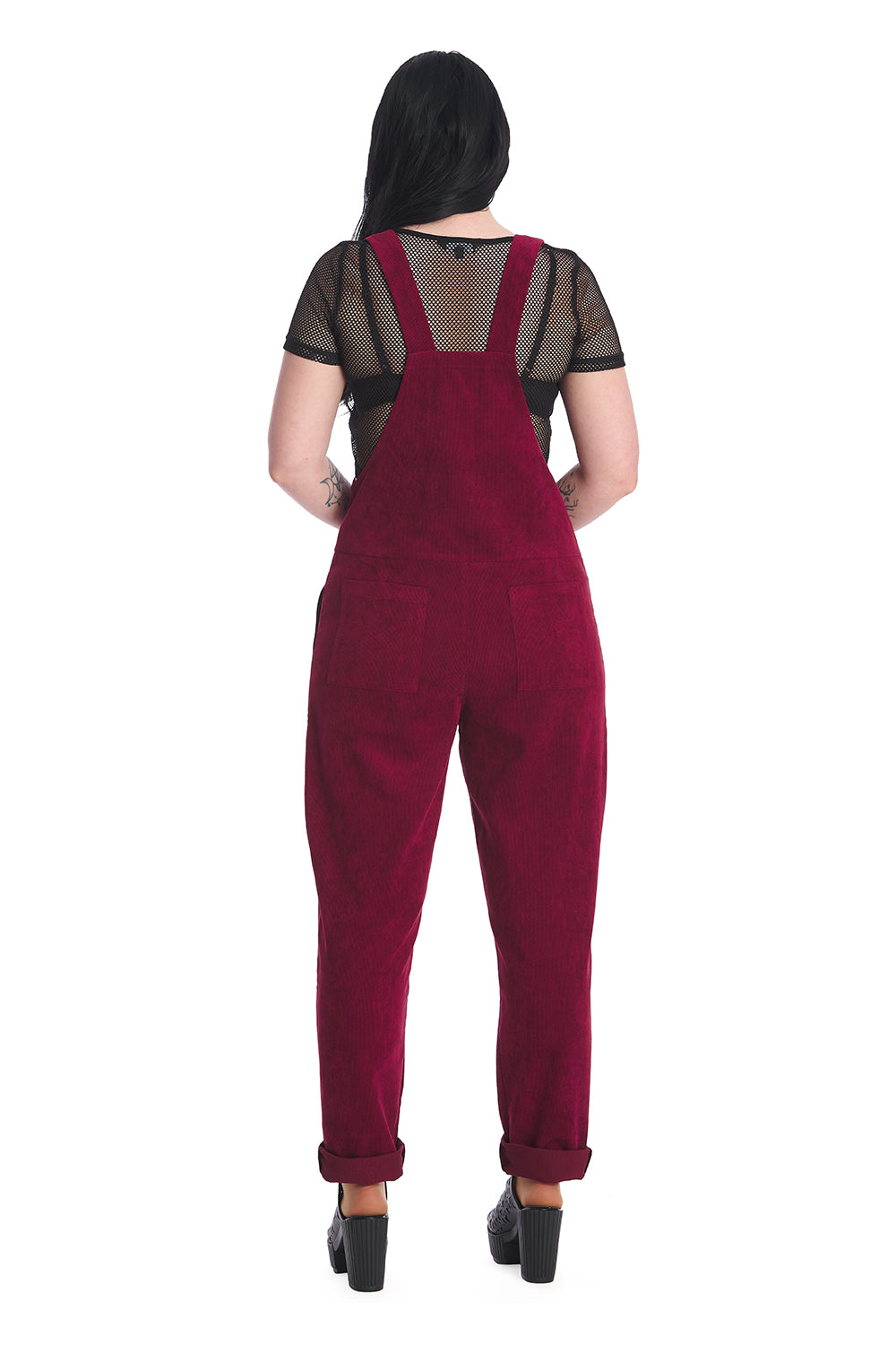 Gothic model in burgundy dungarees with a black mesh top 