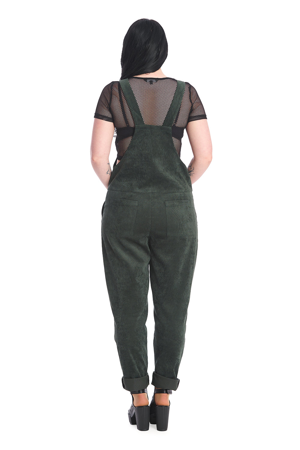 Gothic model in dark green dungarees with a black mesh top 