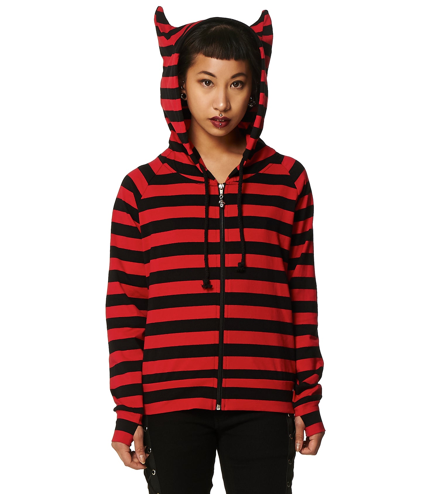 Model wearing a red and black stripes zip up hoodie with cat ears on the hood and thumb holes in the sleeves