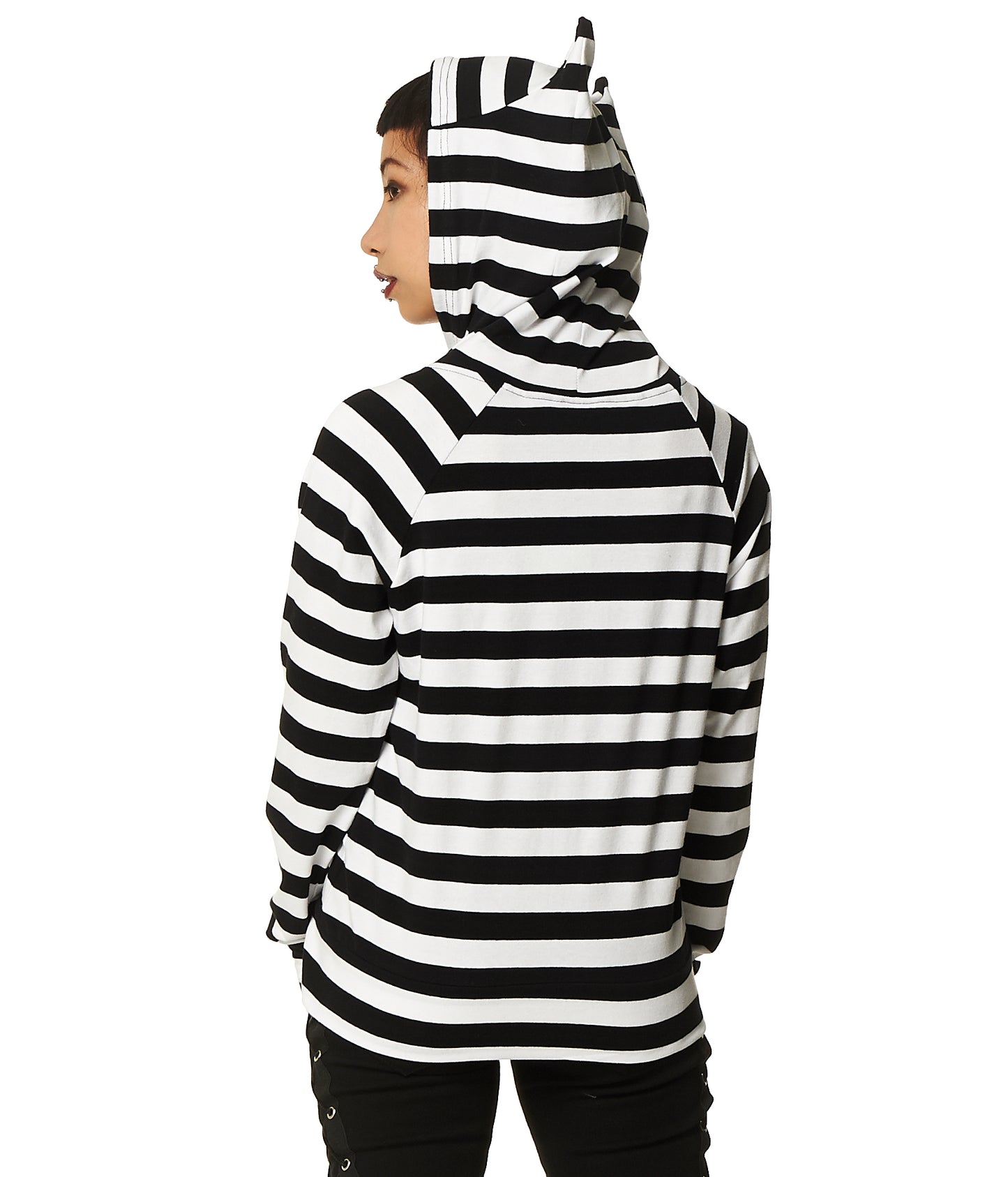 Model wearing a black and white stripes zip up hoodie with cat ears on the hood and thumb holes in the sleeves